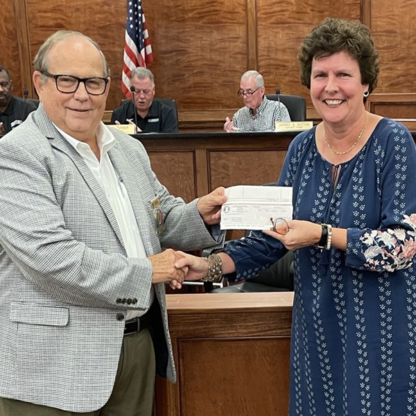 City of Leeds Receives $10,000 for Senior Center. Mayor Miller presents a $10,000 check to Ms. Audrey Bryan, Director of Leeds Senior Center.